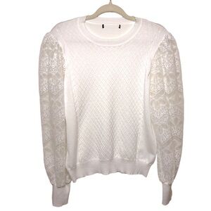 White knitted sweater with lace sleeves